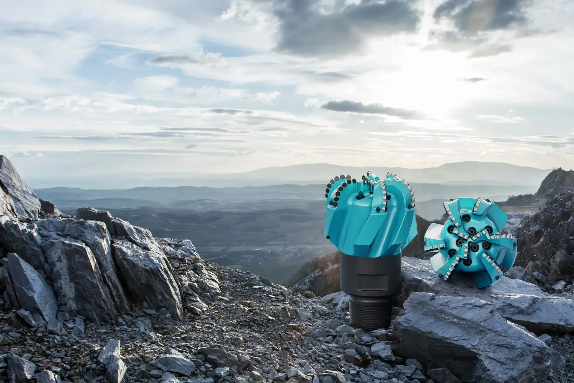 picture homepage hero showing teal bits in front of open country landscape